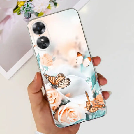 a woman holding a phone case with a butterfly and flowers on it
