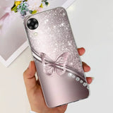 a woman holding a phone case with a butterfly on it