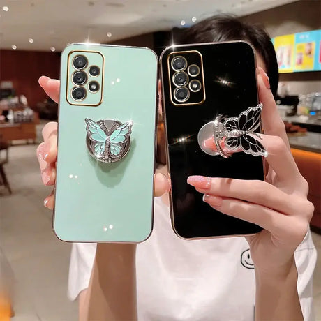 A woman holding a phone case with a butterfly on it