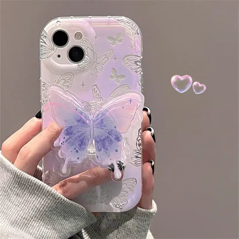 a woman holding a phone case with a butterfly design
