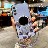 a woman holding a phone case with a camera attached to it