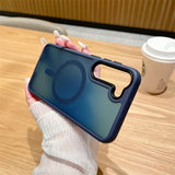 A woman holding a phone case with a camera lens