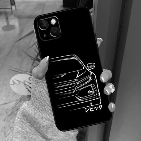 A woman holding up a phone case with a car logo