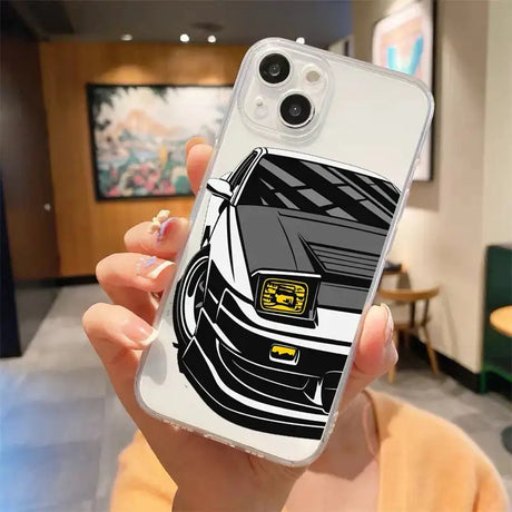 A woman holding a phone case with a car design