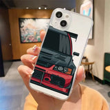 a woman holding up a phone case with a car on it