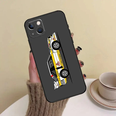 A woman holding a phone case with a car on it