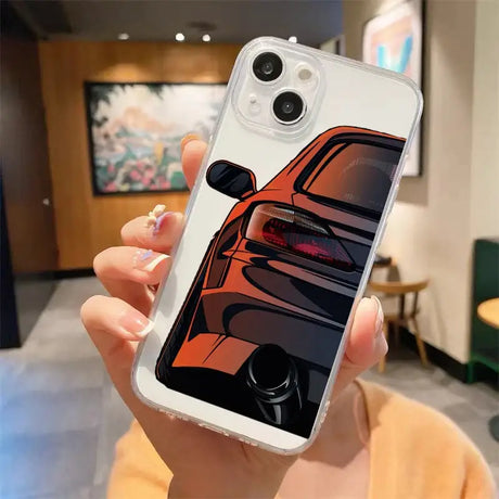 A woman holding a phone case with a car design