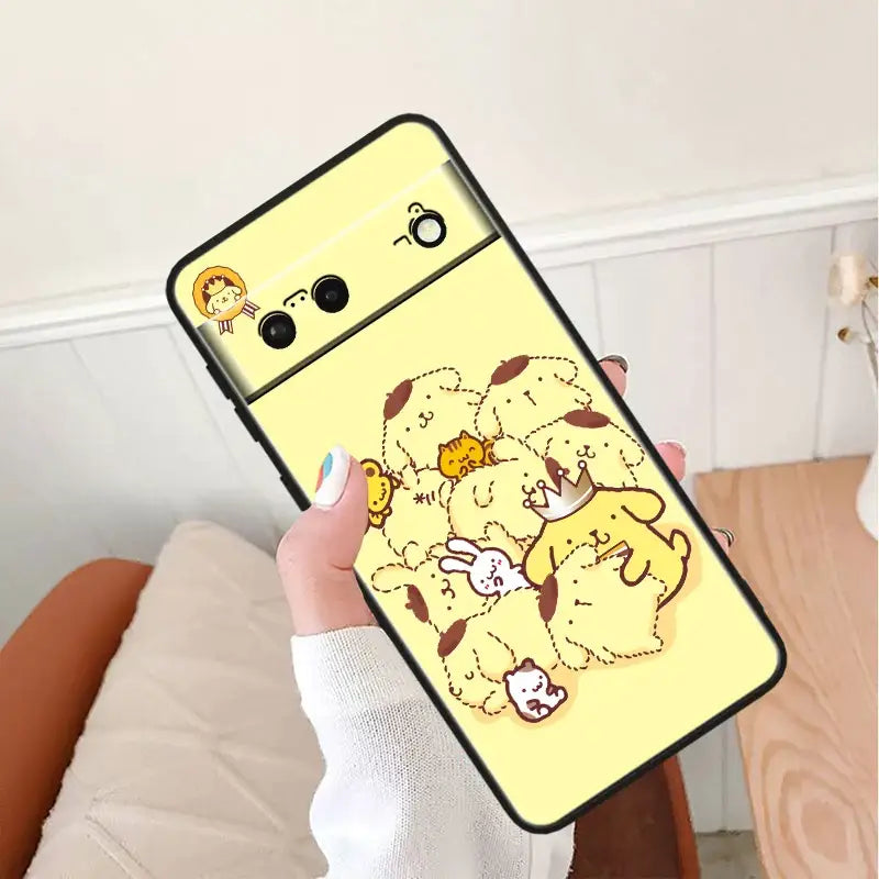 a woman holding a phone case with a cartoon character