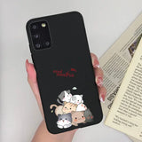 a woman holding a phone case with a cartoon character
