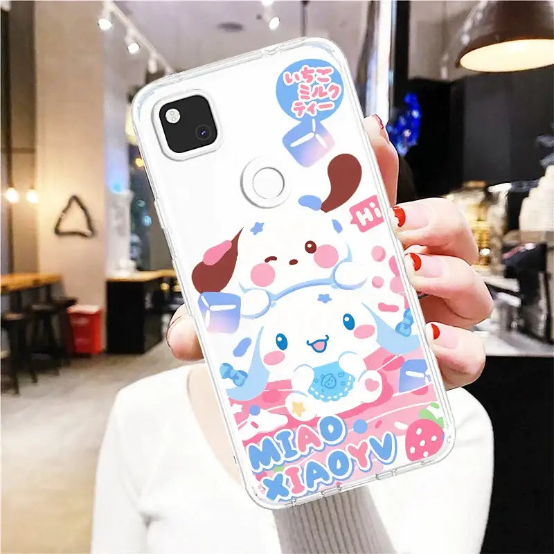 A woman holding up a phone case with a cartoon character design