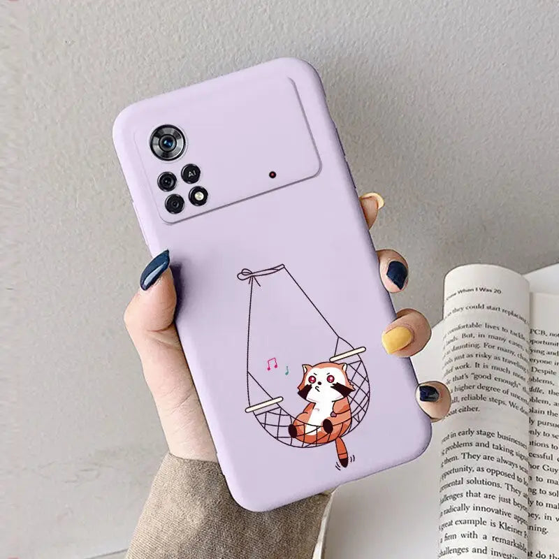 a woman holding a phone case with a cartoon fox on it