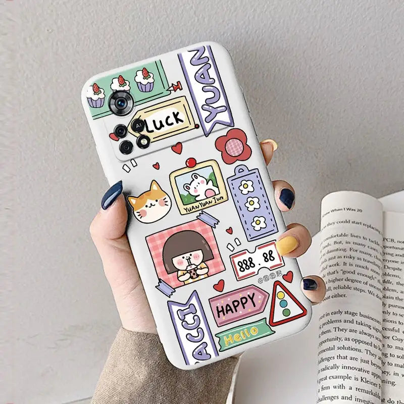 a woman holding a phone case with a cartoon character design