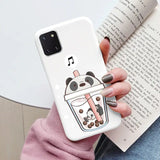 a woman holding a phone case with a cartoon character