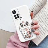 a woman holding a phone case with a cartoon character