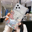 A woman holding up a phone case with a cartoon drawing on it