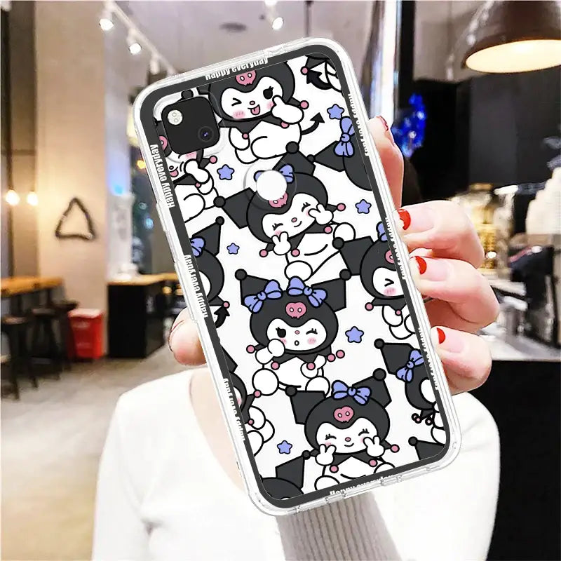 a woman holding a phone case with a cartoon character pattern