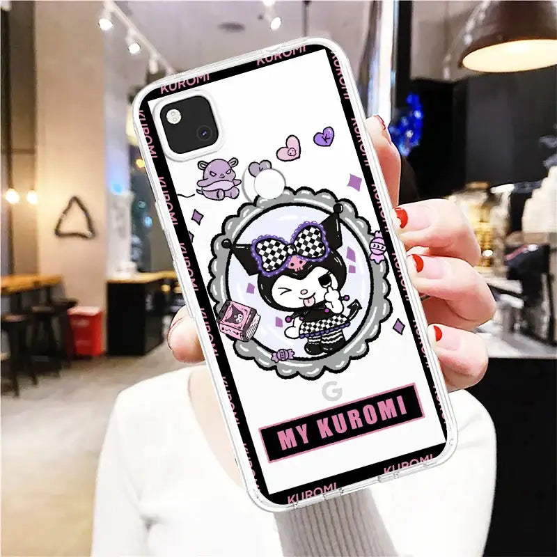 A woman holding up a phone case with a cartoon cat