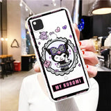 a woman holding up a phone case with a cartoon cat