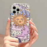 a woman holding a phone case with a cartoon sun and stars