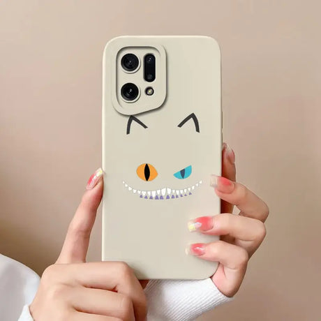 a woman holding a phone case with a cartoon face