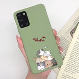 a woman holding a phone case with a cat and dog