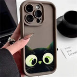 a woman holding a phone case with a cat face on it