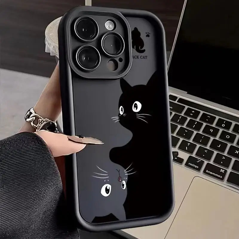 a woman holding a phone case with a cat face on it