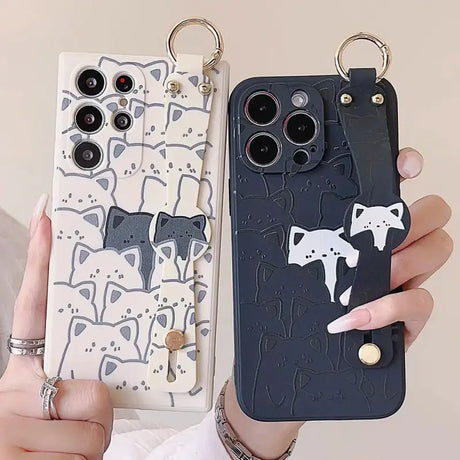 a woman holding a phone case with a cat design