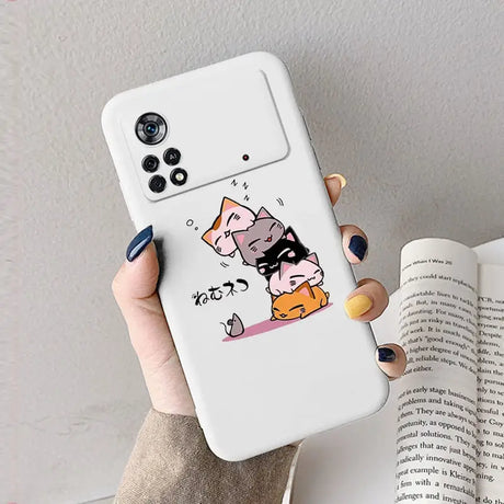 A woman holding a phone case with a cat and dog