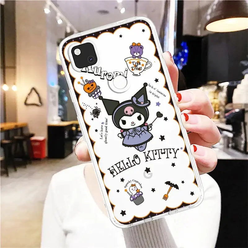 a woman holding up a phone case with a cat and ghost