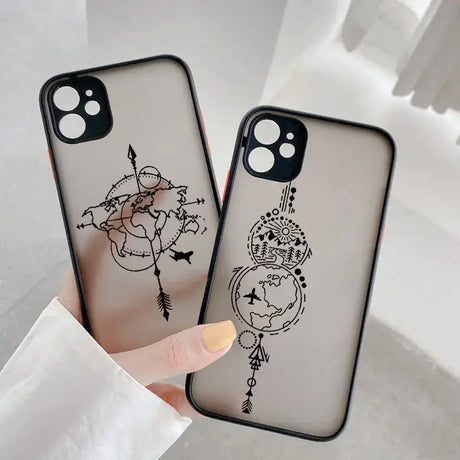 A woman holding a phone case with a drawing of a cat and a bird