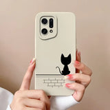 a woman holding a phone case with a cat on it