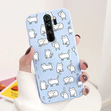 a woman holding a phone case with cats on it