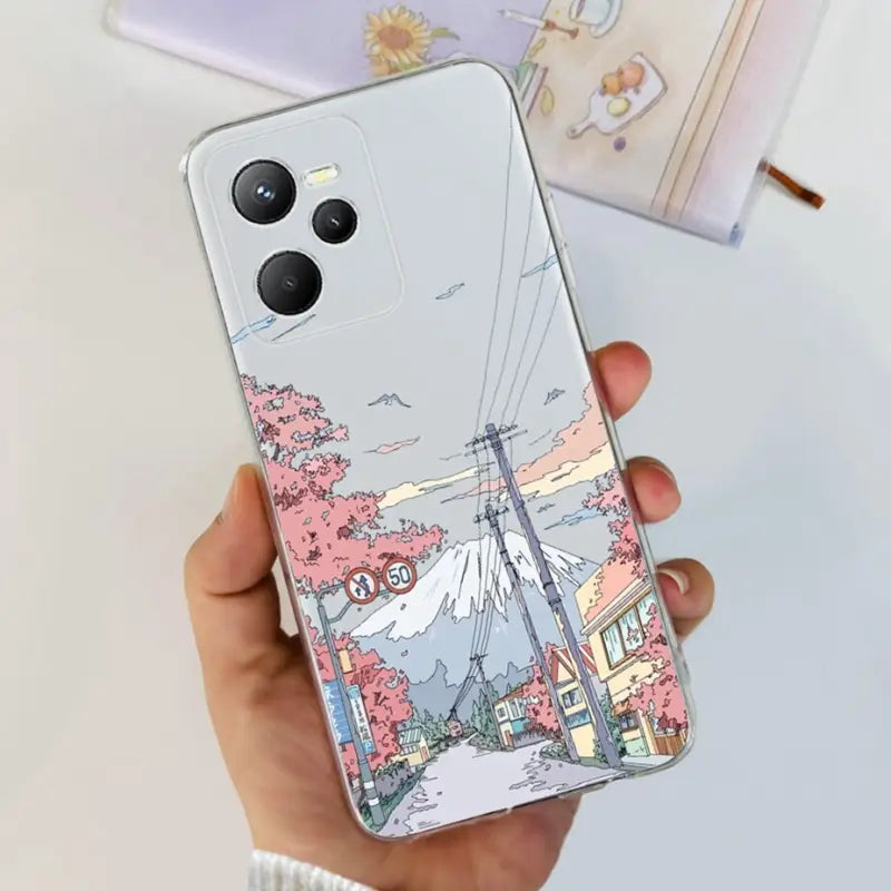 a woman holding a phone case with a drawing of a city