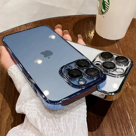 A woman holding a phone case with a coffee cup in the background