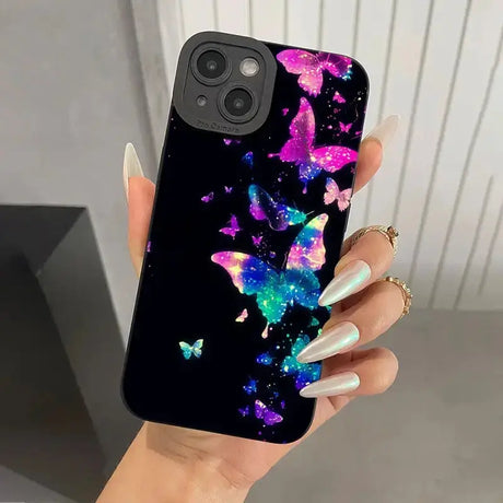 A woman holding a phone case with a colorful galaxy design