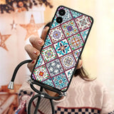 a woman holding a phone case with a colorful pattern