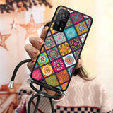 a woman holding a phone case with colorful patterns