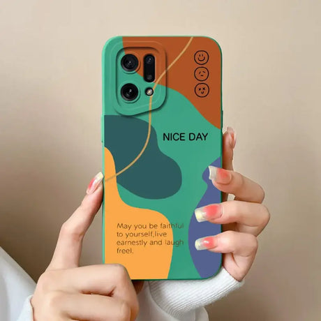 A woman holding a phone case with a colorful design