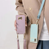 a woman holding a phone case with a phone in it