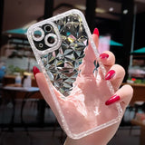 a woman holding a phone case with a diamond pattern