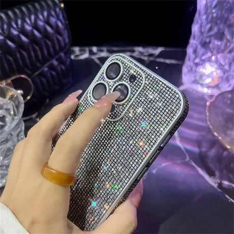 a woman holding a phone case with a diamond pattern