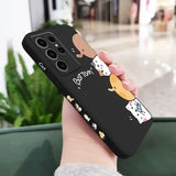 a woman holding a phone case with a dog on it