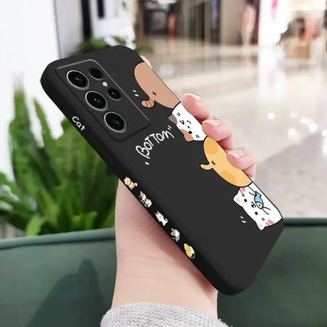 A woman holding a phone case with a dog on it