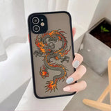 a woman holding a phone case with a dragon design