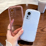 a woman holding a phone case on her finger