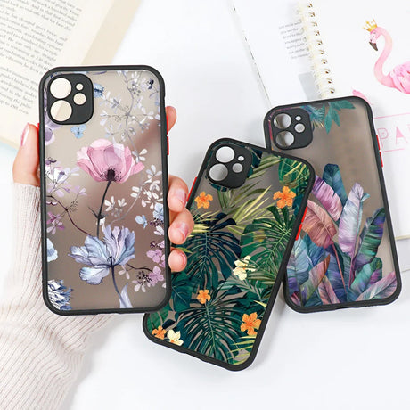 A woman holding a phone case with a floral design