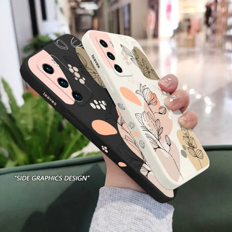 a woman holding a phone case with a flower pattern