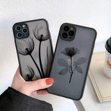 a woman holding a phone case with a flower on it