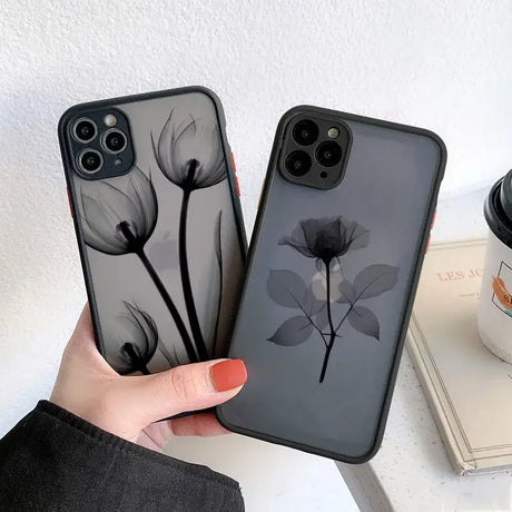 A woman holding a phone case with a flower on it